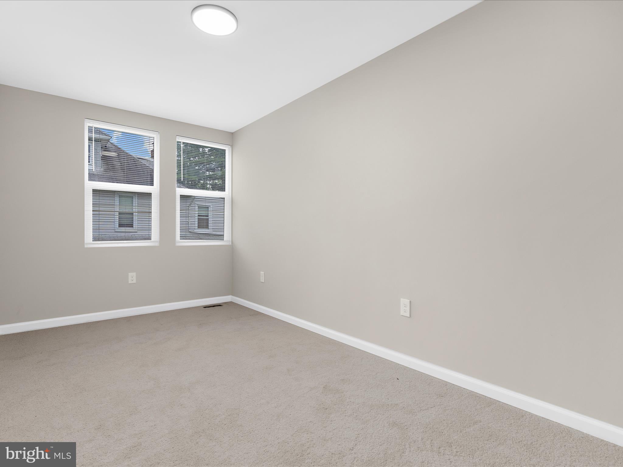 3708 Mohawk Avenue Baltimore, MD 21207 - Photo 33 of 54 an empty room with windows