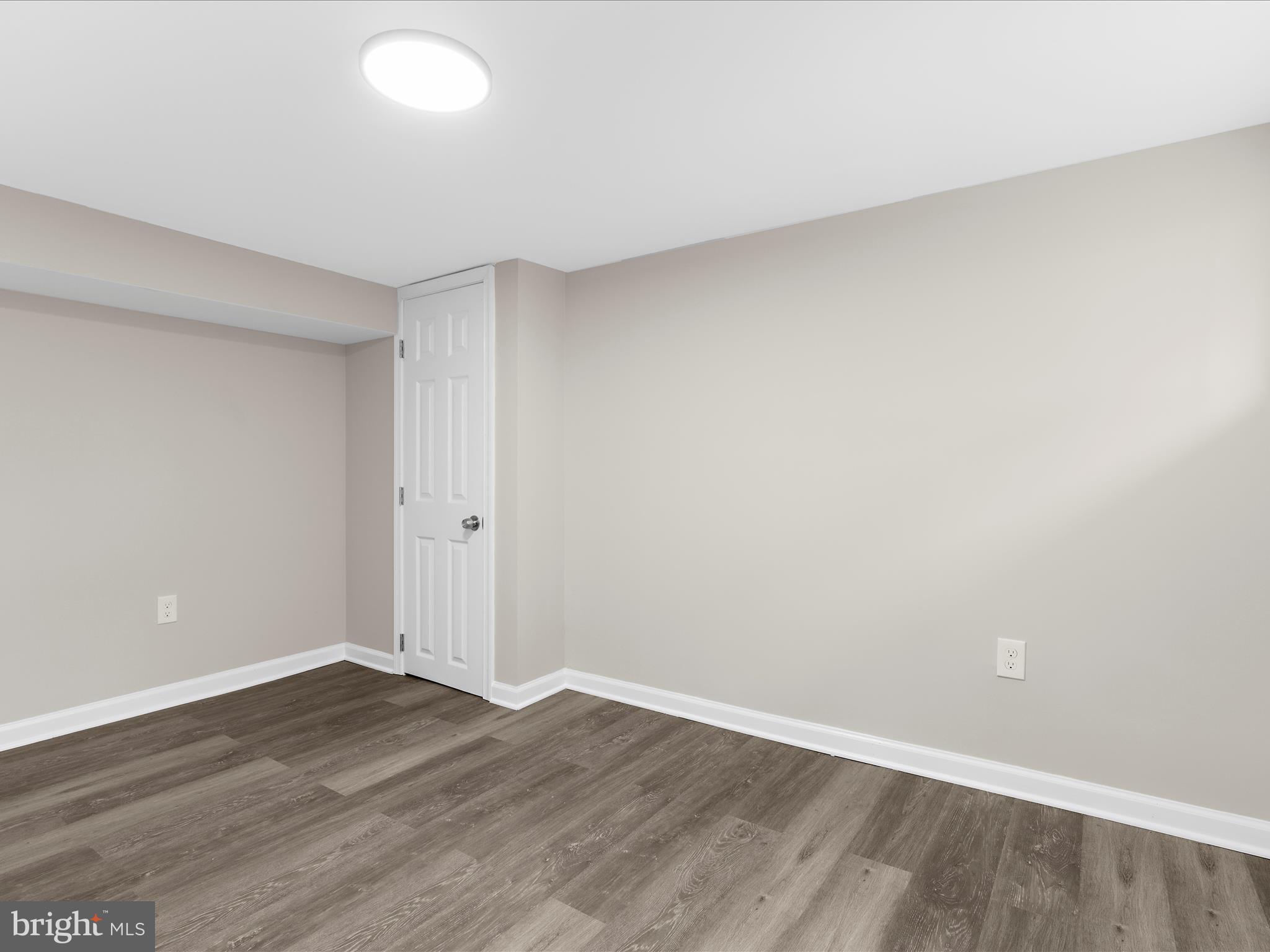 3708 Mohawk Avenue Baltimore, MD 21207 - Photo 41 of 54 a view of an empty room with wooden floor