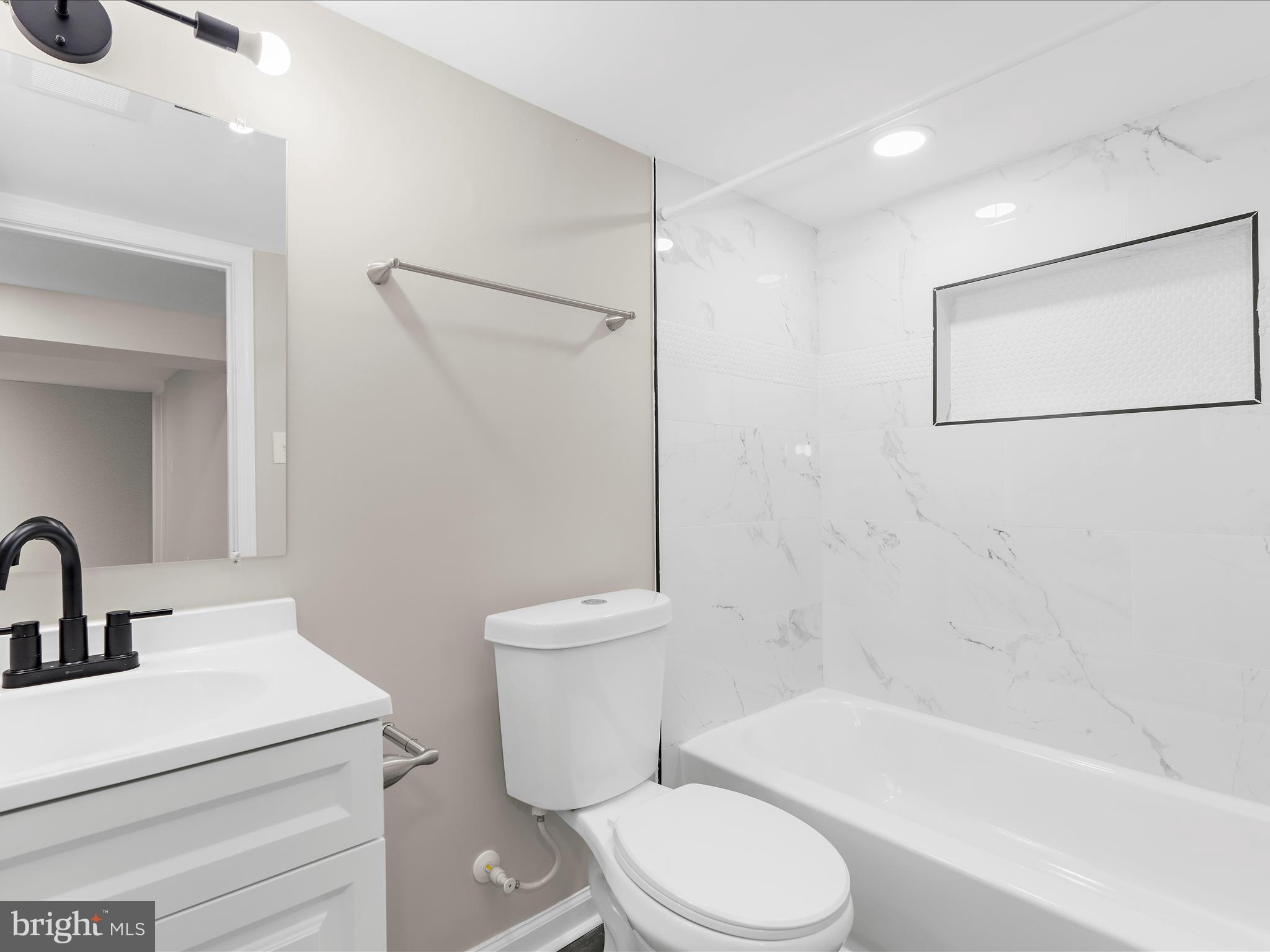 3708 Mohawk Avenue Baltimore, MD 21207 - Photo 42 of 54 a bathroom with a toilet sink and shower