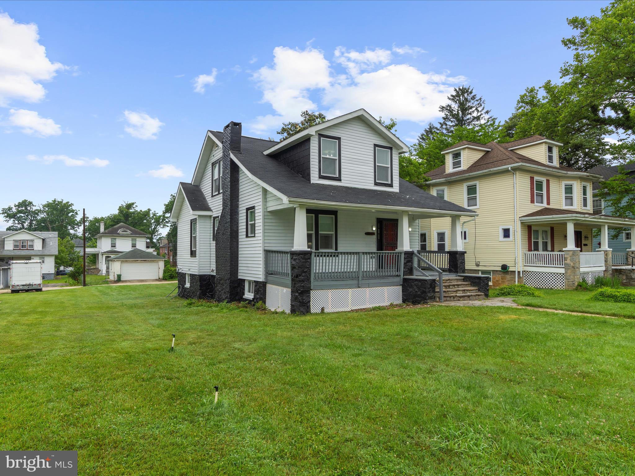 3708 Mohawk Avenue Baltimore, MD 21207 - Photo 48 of 54 a view of a house with a yard and sitting area