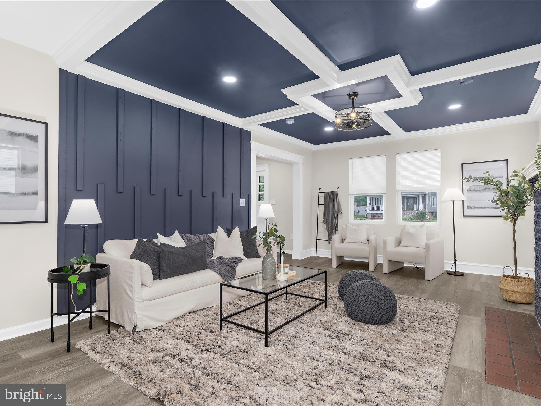 3708 Mohawk Avenue Baltimore, MD 21207 - Photo 8 of 54 a living room with furniture a rug and a chandelier