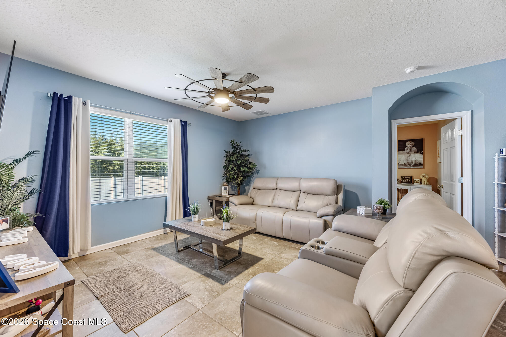 3054 Toulon Road Southeast Palm Bay, FL 32909 - Photo 12 of 30 a living room with furniture and a window