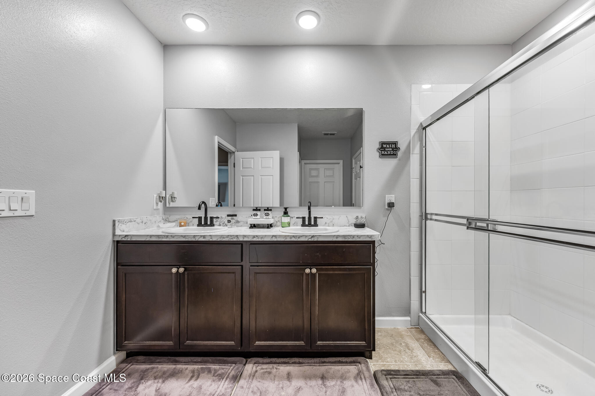 3054 Toulon Road Southeast Palm Bay, FL 32909 - Photo 15 of 30 a bathroom with a sink and a mirror
