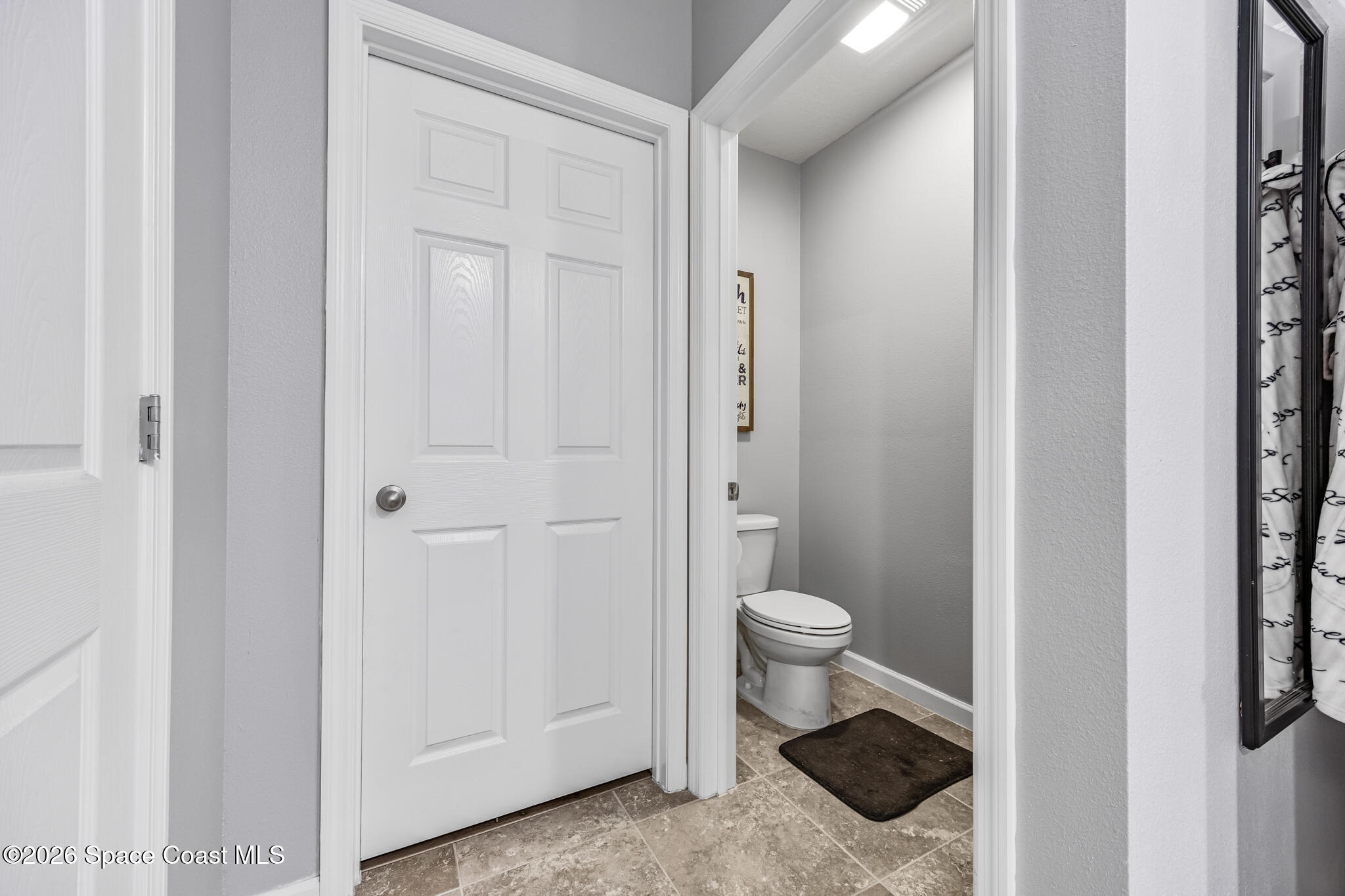 3054 Toulon Road Southeast Palm Bay, FL 32909 - Photo 17 of 30 a bathroom with a granite countertop toilet and a sink