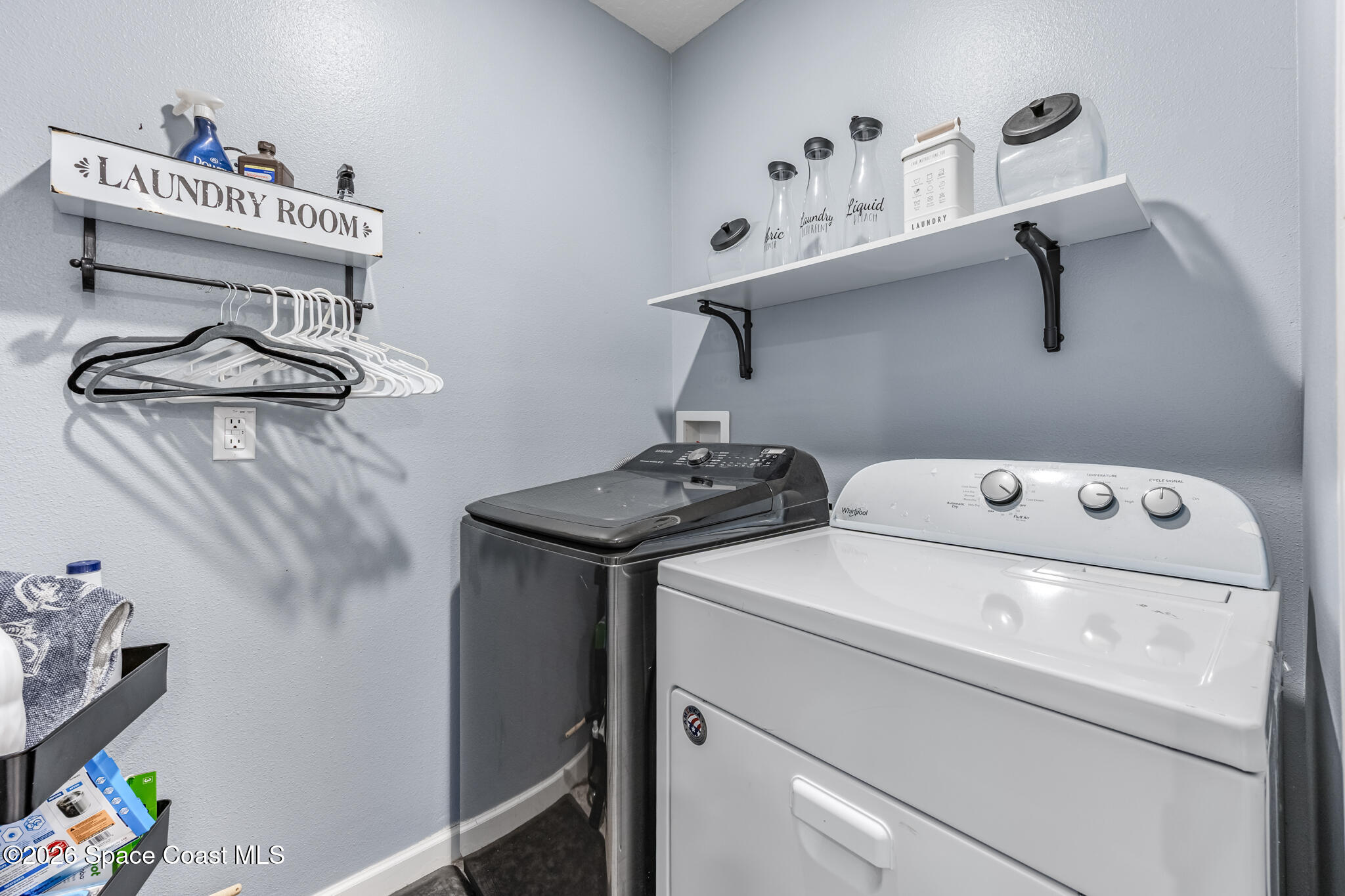 3054 Toulon Road Southeast Palm Bay, FL 32909 - Photo 25 of 30 a utility room with dryer and washer