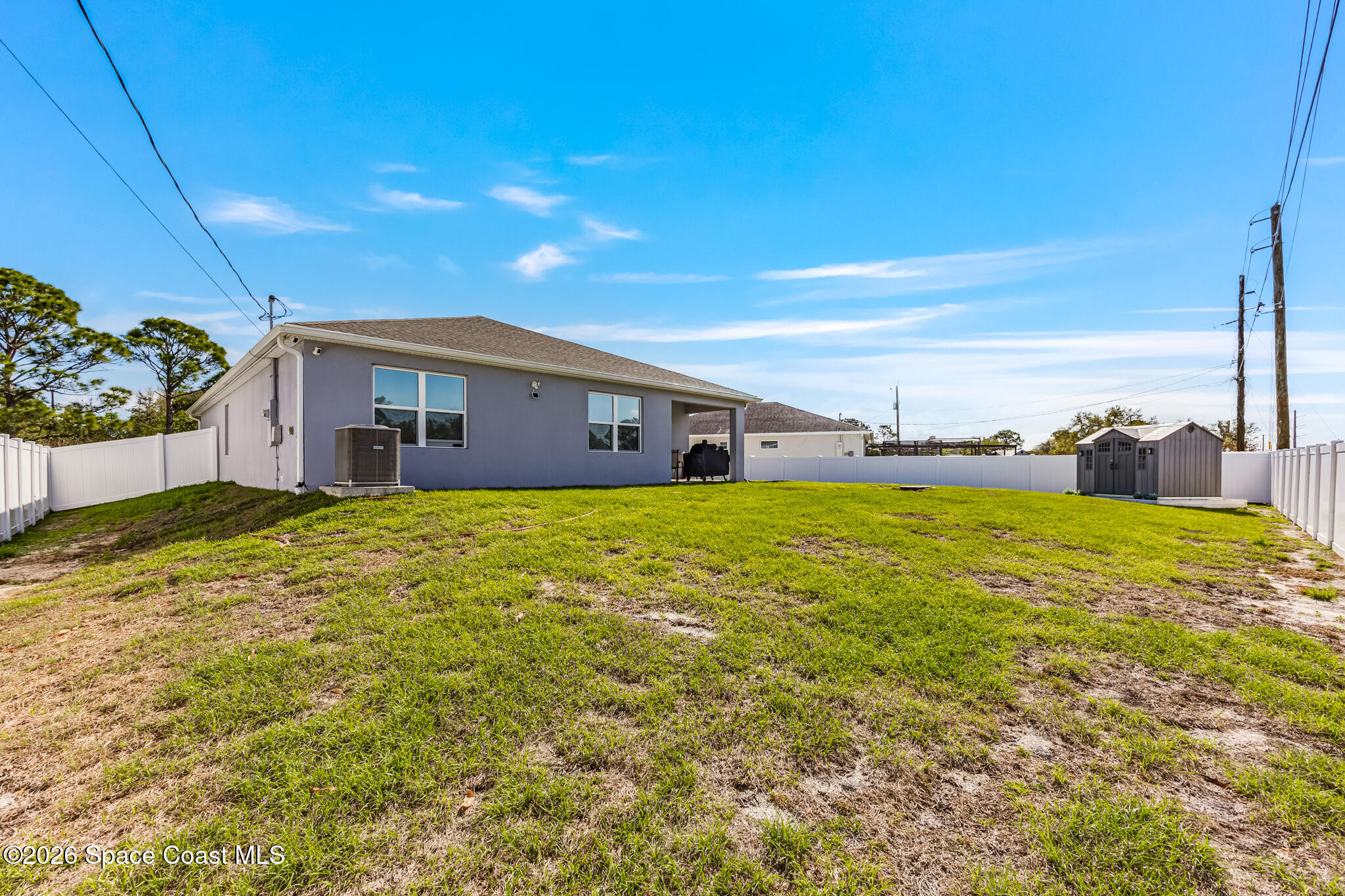 3054 Toulon Road Southeast Palm Bay, FL 32909 - Photo 27 of 30 a front view of house with a garden