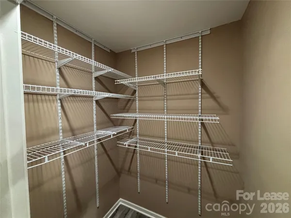 a view of a room with racks on the wall