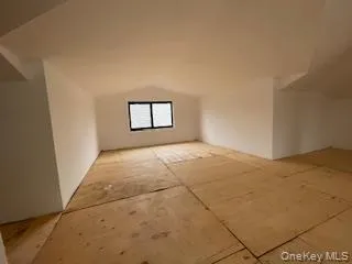 a view of empty room with windows