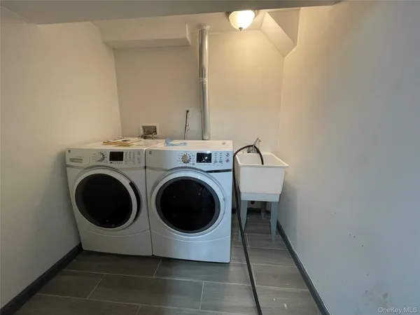 a utility room with dryer and washer