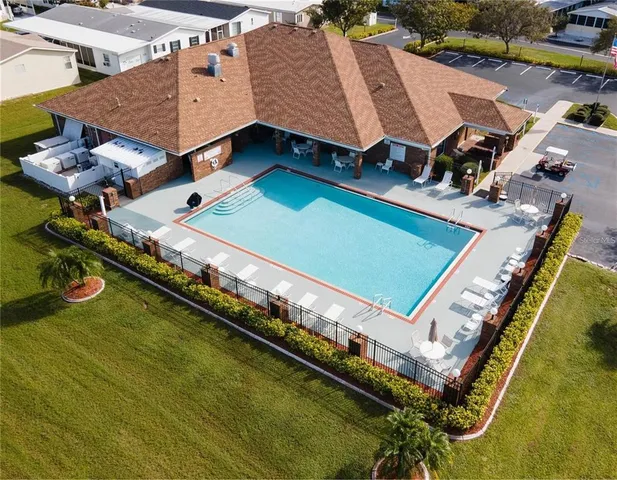 an aerial view of a house with a swimming pool