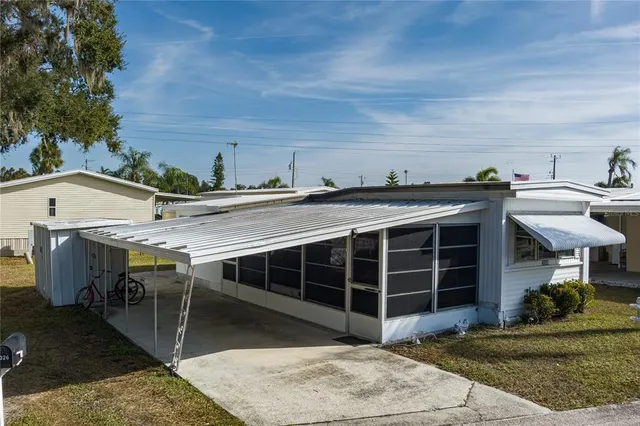 a view of a patio with table and chairs a barbeque with wooden fence