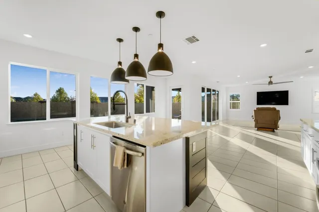 a view of a living room and a balcony