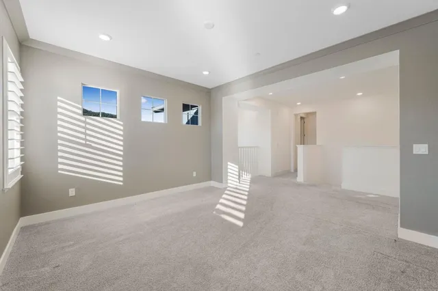 a bedroom with a bed and a potted plant