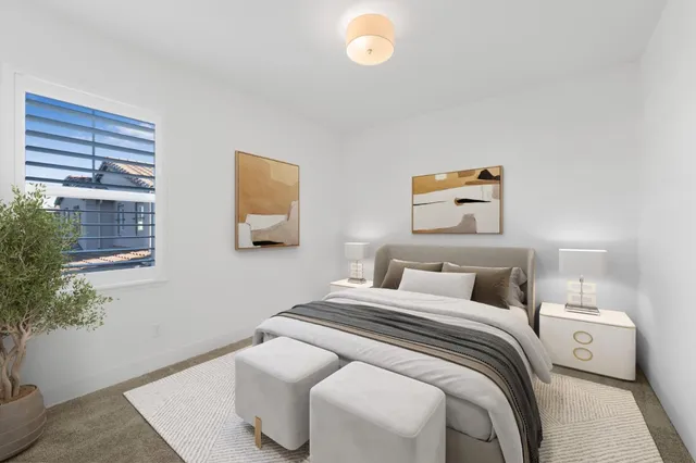 a view of a hallway with wooden cabinets