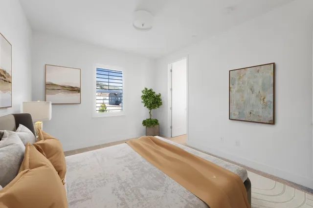 a utility room with cabinets washer and dryer
