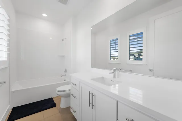 a swimming pool with buildings in the background