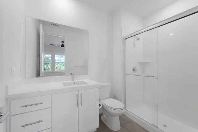 a dining room with furniture a chandelier and glass door