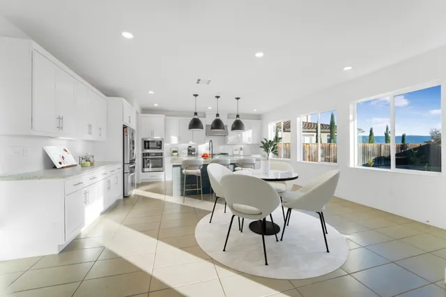 a kitchen with stainless steel appliances granite countertop a stove and a sink