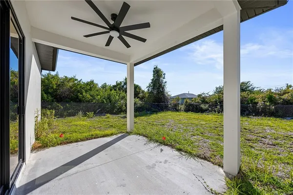 a view of a room with a big yard and a large window