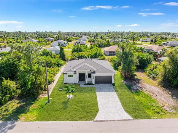 a aerial view of a house with a yard