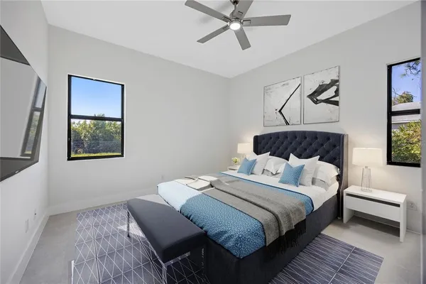 a bedroom with a bed and a window