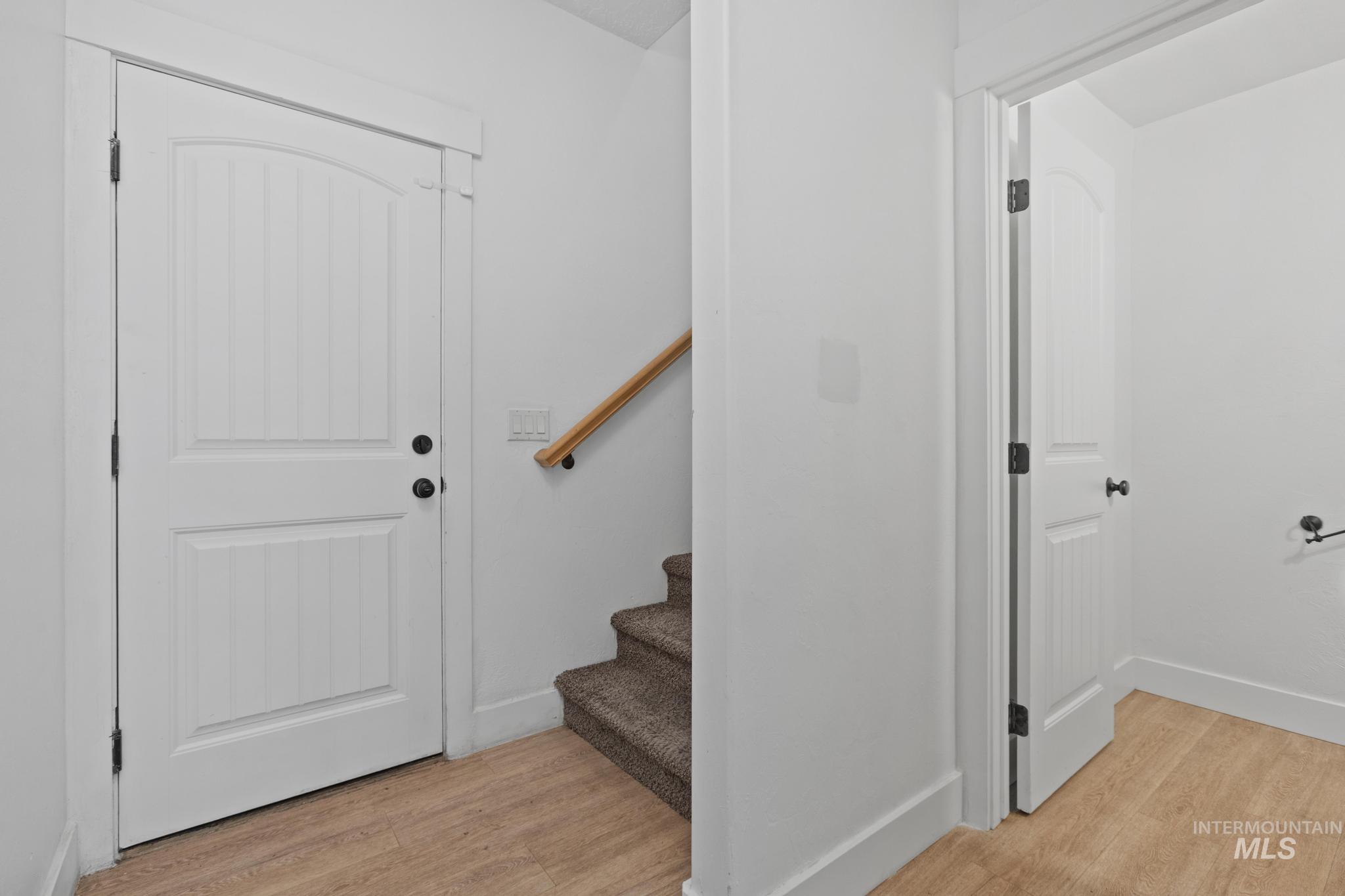 5271 West Morris Hill Road Boise, ID 83706 - Photo 12 of 32 Staircase featuring wood finished floors