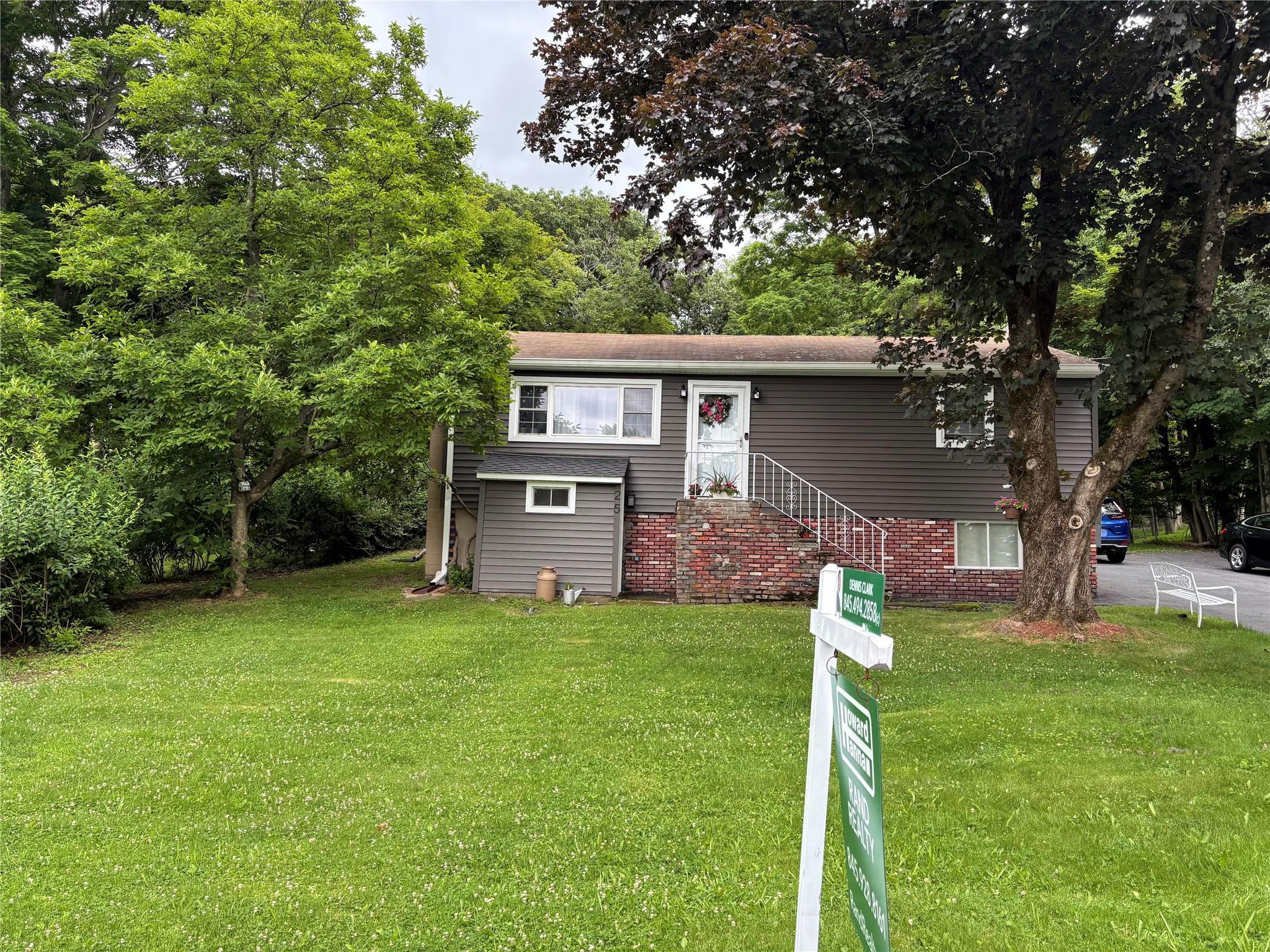 25 Laura Road Monroe, NY 10950 - Photo 1 of 1 a front view of a house with garden