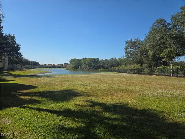 a view of a lake with a big yard