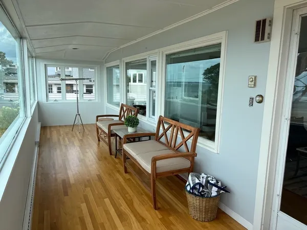 a outdoor living space with furniture and wooden floor