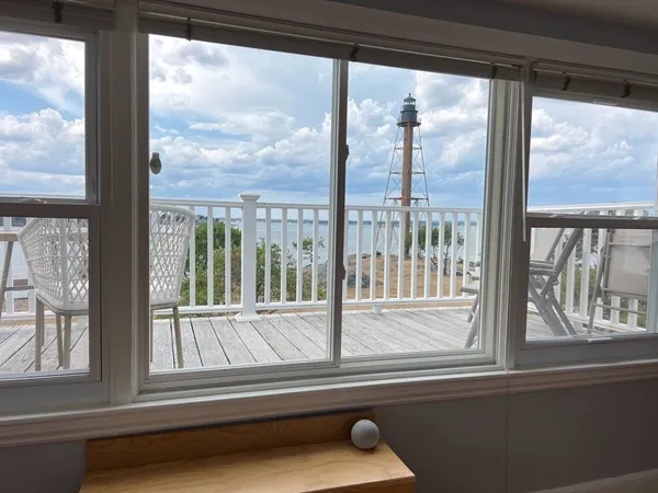 a view of a glass door and a porch
