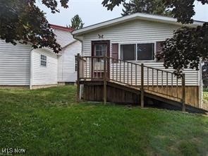 2070 Riggle Road Bellville, OH 44813 - Photo 4 of 47 Back of house featuring a wooden deck and a yard