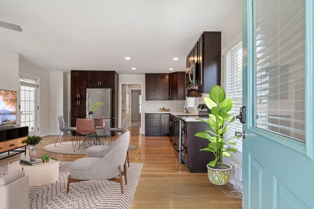 a lobby with furniture and a potted plant