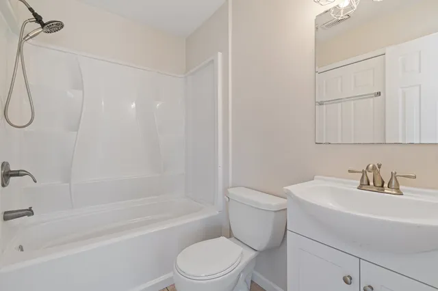 a bathroom with a sink a toilet and a bathtub