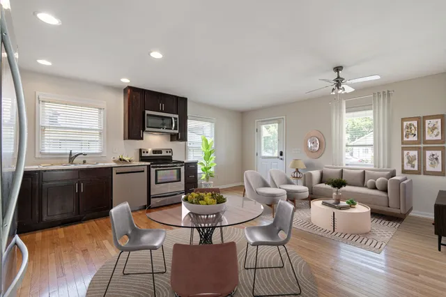 a living room with fireplace furniture and a window