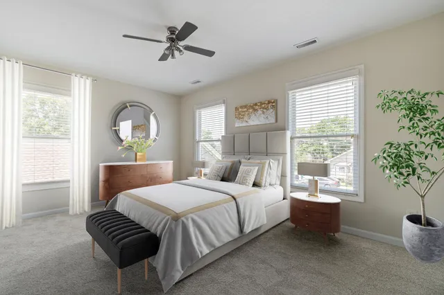 a bedroom with a large bed and a window