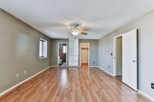 236 Richard Court Ridgecrest, CA 93555 - Photo 17 of 29 a view of an empty room with window and wooden floor