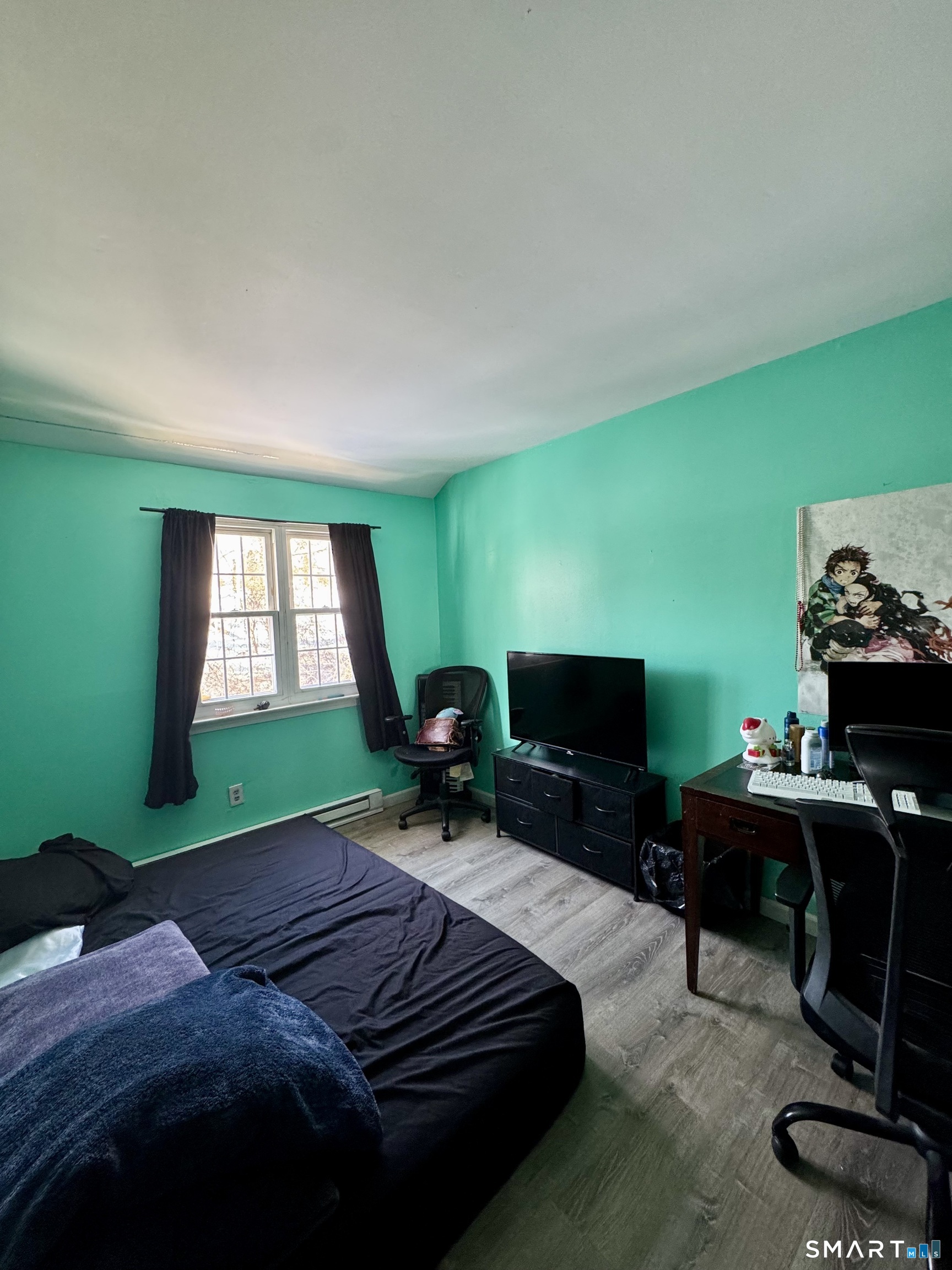 12-16 Scuppo Road, Unit D4 Danbury, CT 06811 - Photo 8 of 8 a bedroom with a bed and a chair