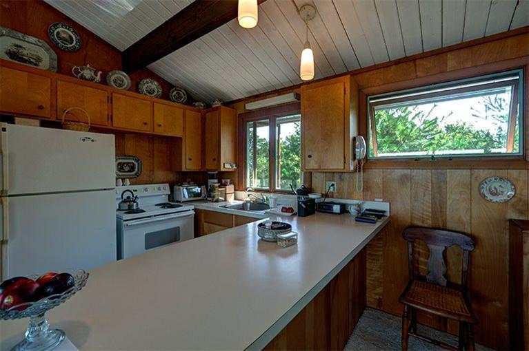 15 Hart Road Truro, MA 02666 - Photo 8 of 30 a kitchen with refrigerator and stove