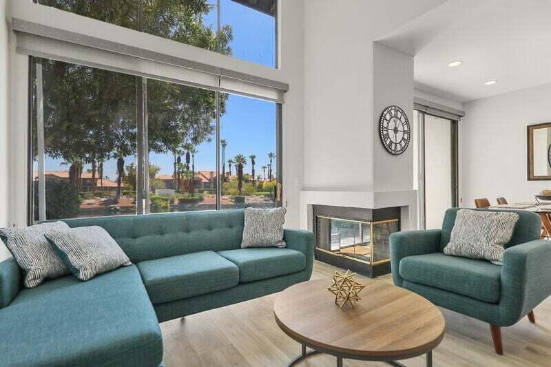 55288 Firestone La Quinta, CA 92253 - Photo 1 of 20 a living room with furniture and a fireplace