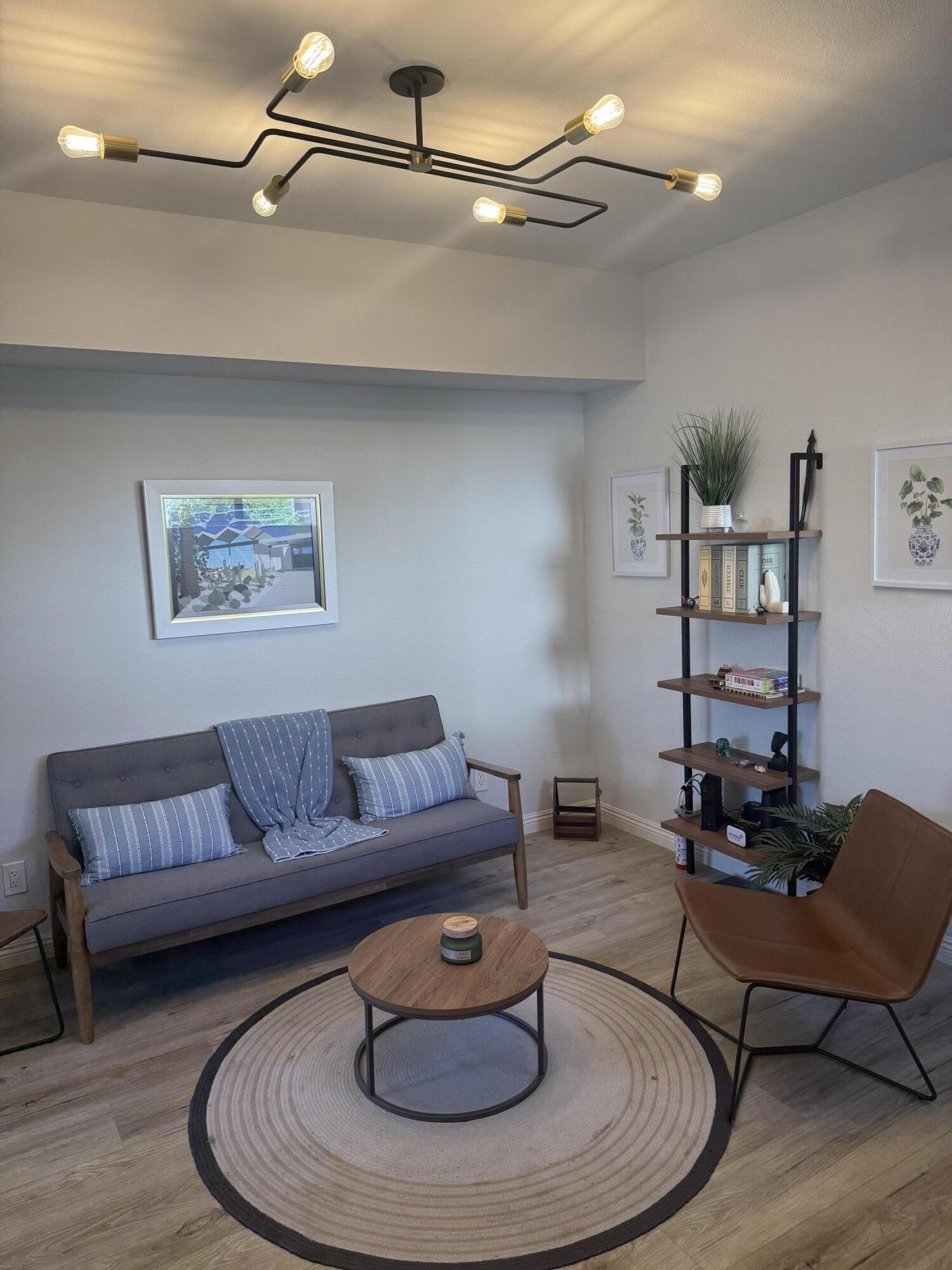 55288 Firestone La Quinta, CA 92253 - Photo 12 of 20 a living room with furniture and a wooden floor