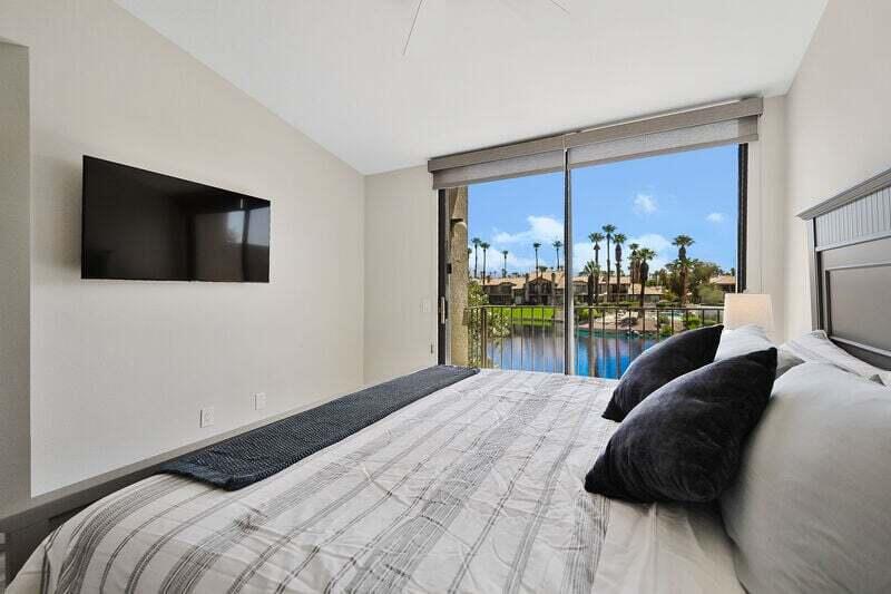 55288 Firestone La Quinta, CA 92253 - Photo 14 of 20 a bedroom with a bed tv and a window