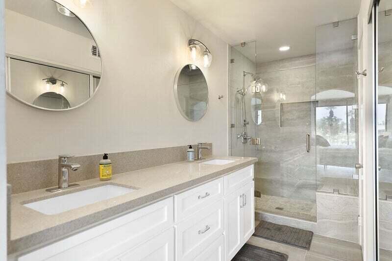 55288 Firestone La Quinta, CA 92253 - Photo 15 of 20 a bathroom with a double vanity sink mirror and shower