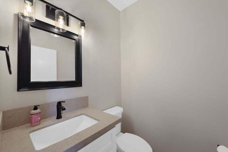 55288 Firestone La Quinta, CA 92253 - Photo 16 of 20 a bathroom with a toilet sink vanity and mirror