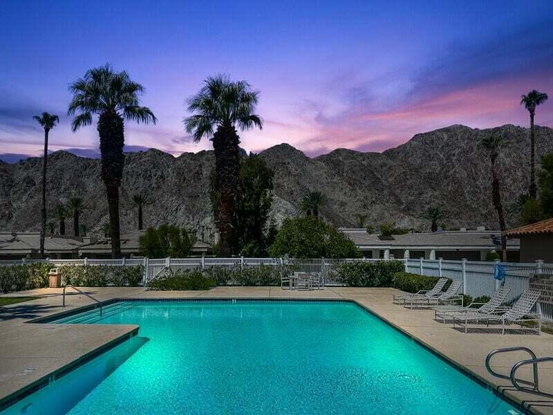 55288 Firestone La Quinta, CA 92253 - Photo 17 of 20 a view of a swimming pool with a table and chairs