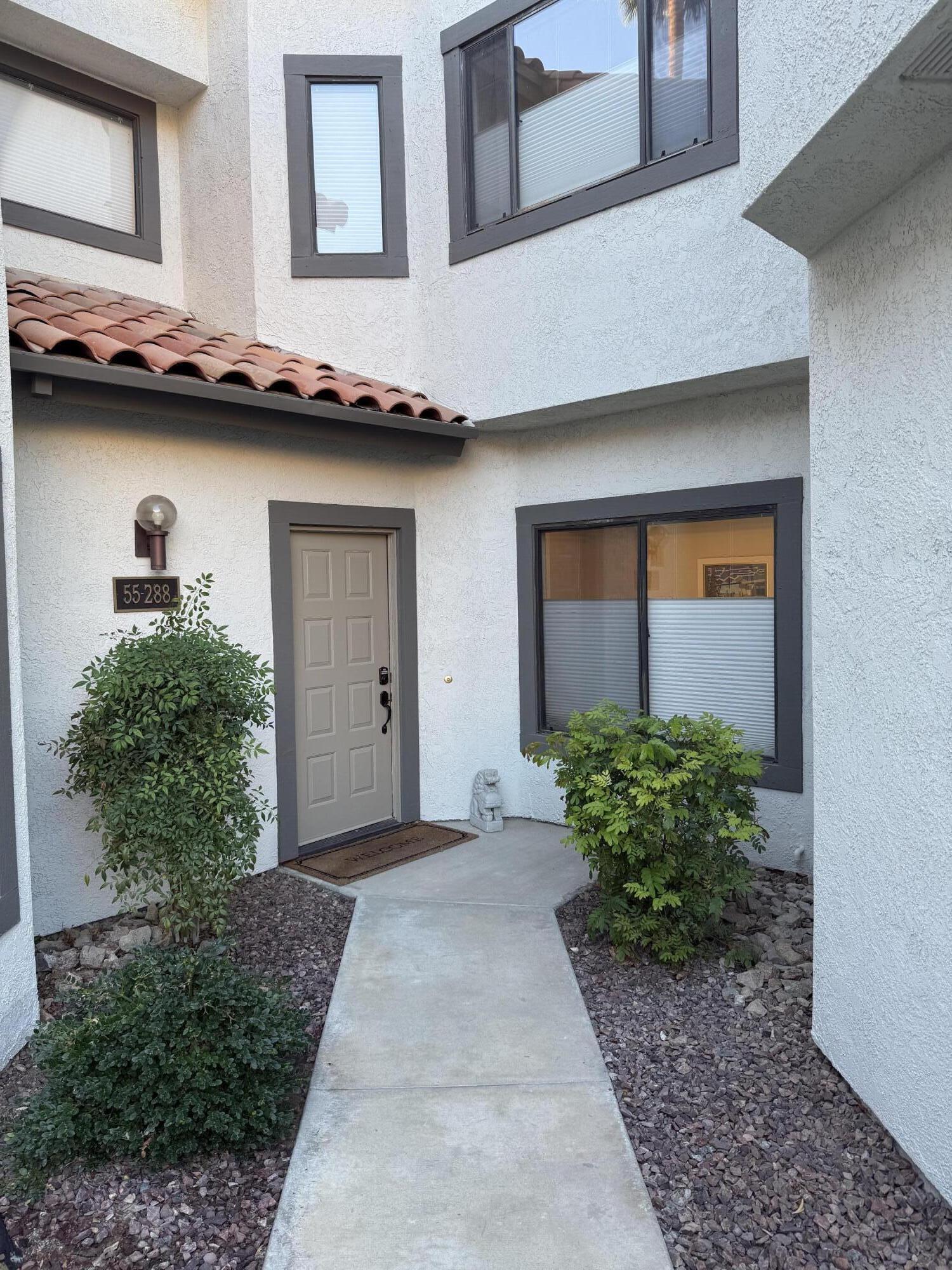 55288 Firestone La Quinta, CA 92253 - Photo 19 of 20 a front view of a house with garden