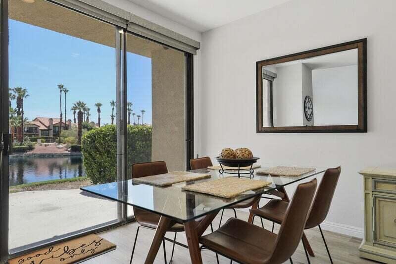 55288 Firestone La Quinta, CA 92253 - Photo 7 of 20 a view of a dining room with furniture window and wooden floor