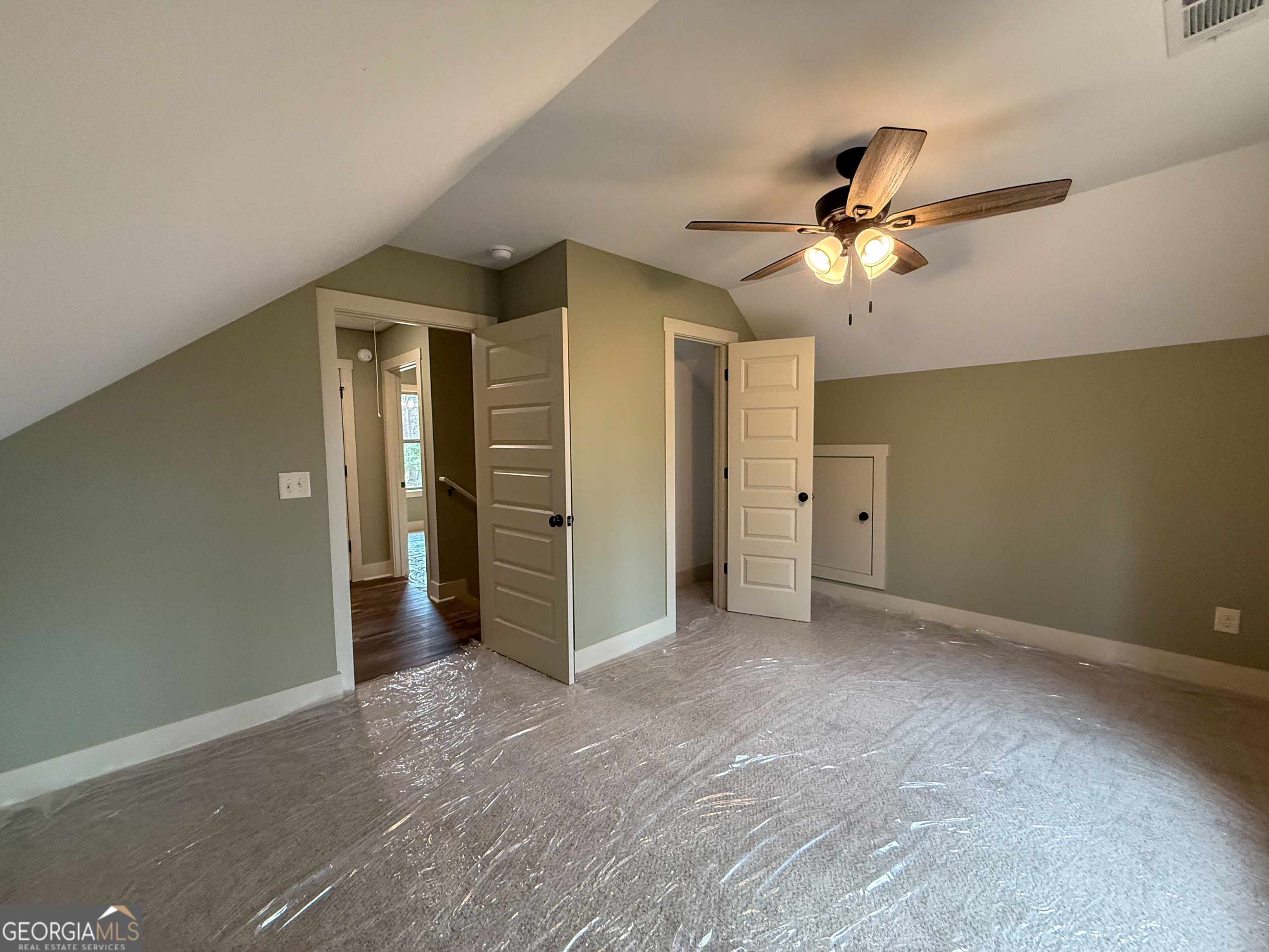 18 Creek Bend Point Cleveland, GA 30528 - Photo 21 of 37 an empty room with closet and a ceiling fan