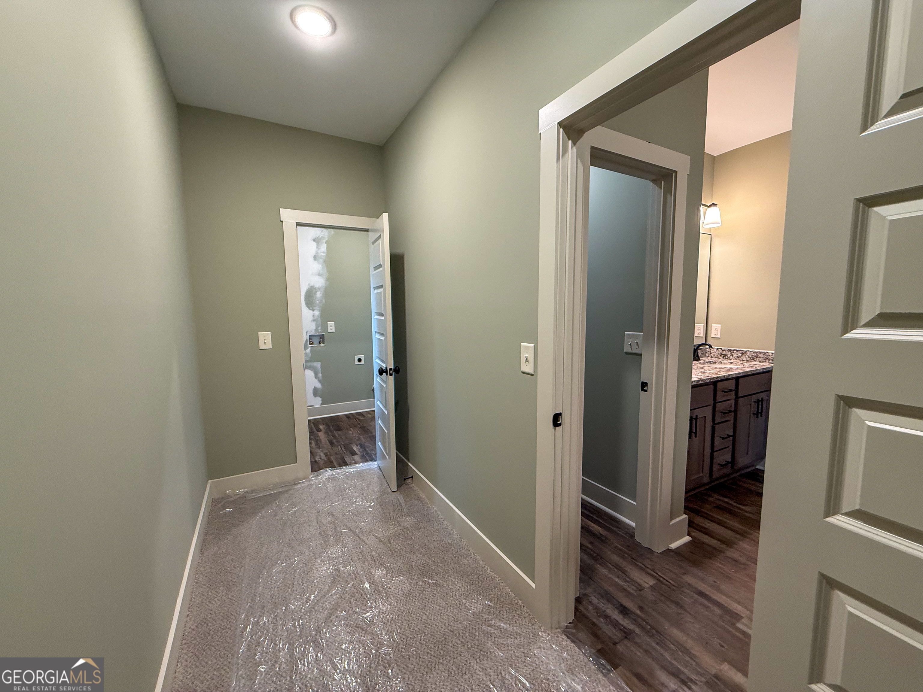 18 Creek Bend Point Cleveland, GA 30528 - Photo 30 of 37 a view of a hallway with wooden floor and closet