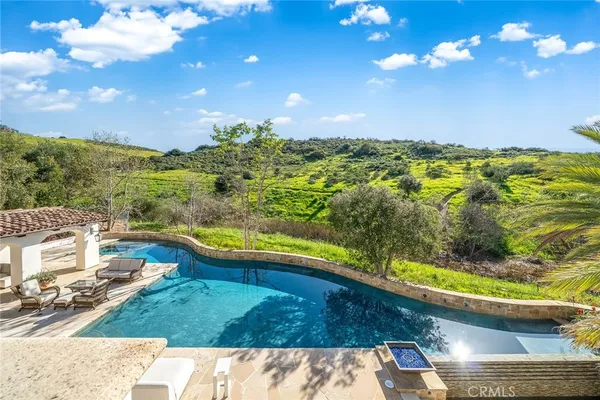 a view of a swimming pool with a yard