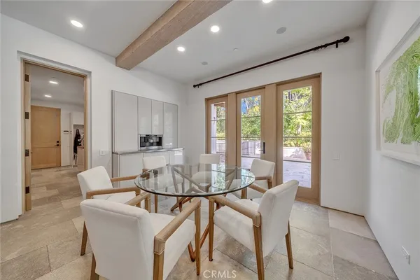 a view of a dining room with furniture window and outside view